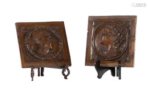 A pair of carved walnut portrait roundels of a Roman Senator...