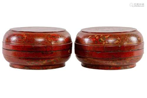 A pair of Chinese red and gilt lacquer circular covered food...