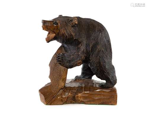 A Hokkaido carved wood bear with a carp, Japanese circa 1900