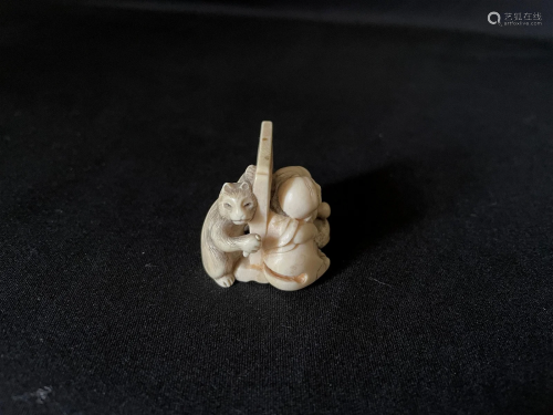 A Carved Cattle Bone Netsuke of Monk and Cat