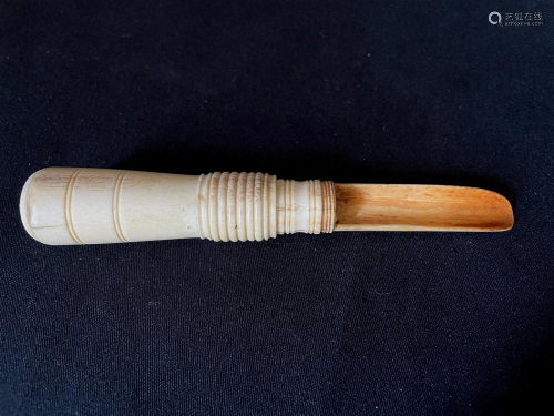 A Carved Cattle Bone Netsuke of Reversible Spoon