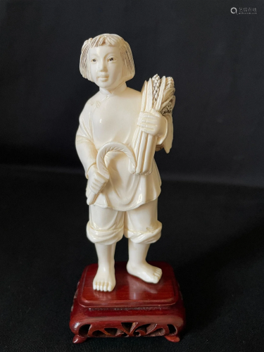 A Carved Cattle Bone Netsuke of Farmer Girl with Sickle