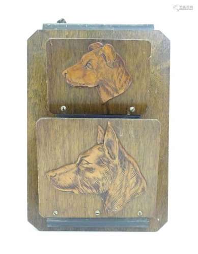 A 20thC wall letter rack with applied dog head detail. Appro...