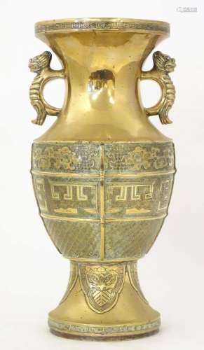 An Oriental cast brass vase of baluster form with twin foo d...