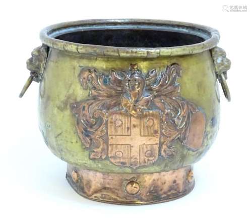 A late 19thC brass and copper planter, decorated with armori...