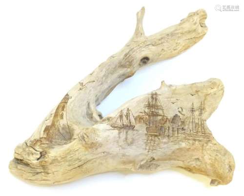 A driftwood bough decorated with 20thC carved nautical scene...