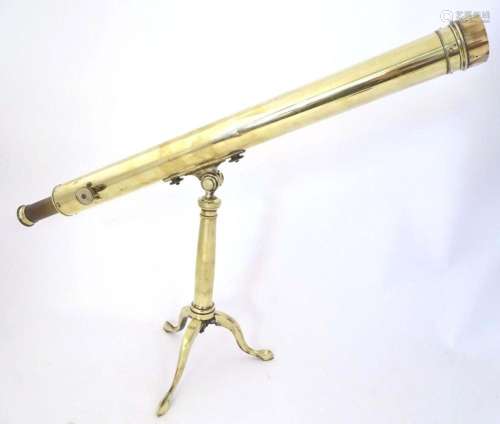 A Victorian brass two-drawer telescope on stand, the tripod ...