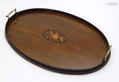 A late 19th / early 20thC mahogany tray of oval form with tw...
