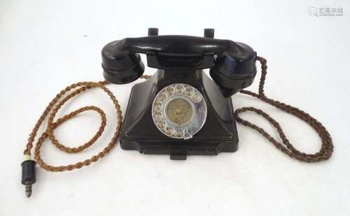 A c1930s GPO 232L telephone, of Bakelite construction with b...