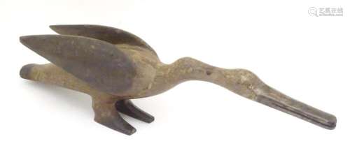 A folk art naive carved wooden model of a stylised goose / b...