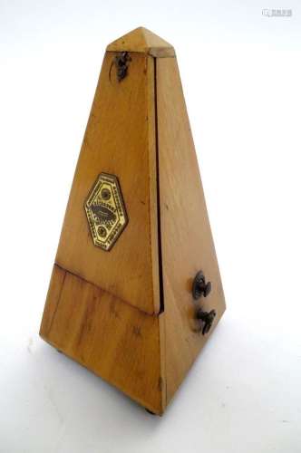 An early 20thC clockwork metronome, the pyramid case bearing...