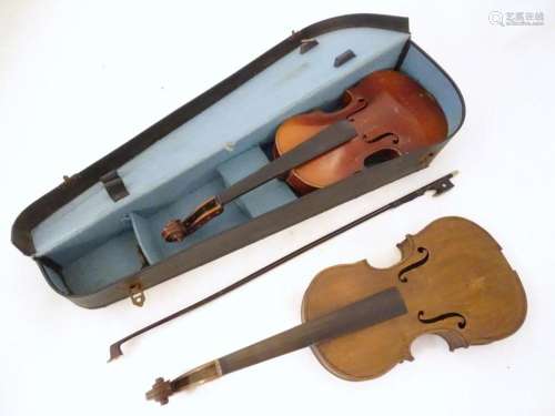 Musical Instruments: the major parts of two mid 20thC violin...