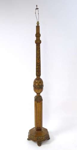 An early 20thC oak standard lamp, adorned with carved fruit,...