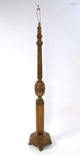An early 20thC oak standard lamp, adorned with carved fruit,...