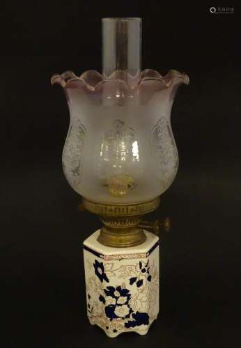 An early 20thC table oil lamp, with Mason s Ironstone hexago...