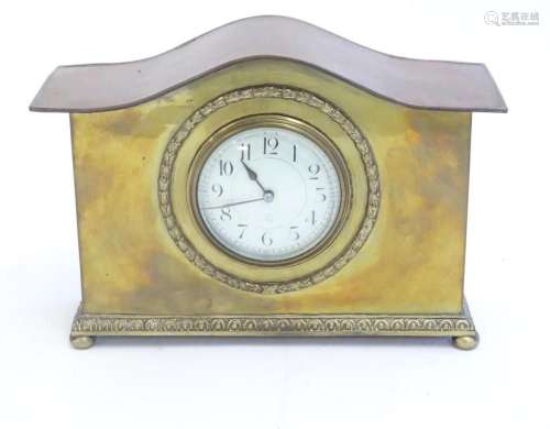 A mantle clock by Japy freres the shaped brass case with ena...