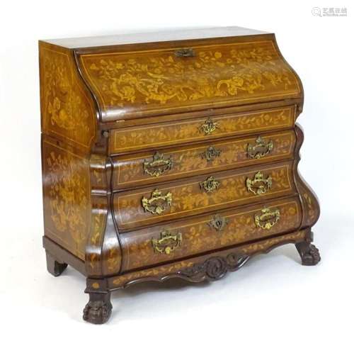 An early 19thC Dutch marquetry bureau of bombe form, having ...