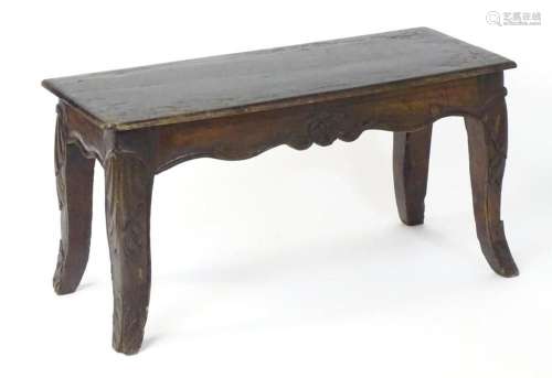 A Louis XV fruitwood bench / stool with a rectangular top ab...