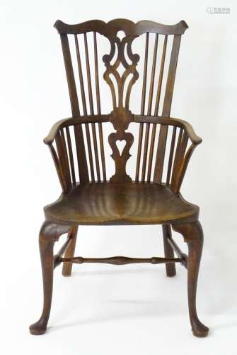 A late 18thC / early 19thC comb back Windsor chair with a sh...