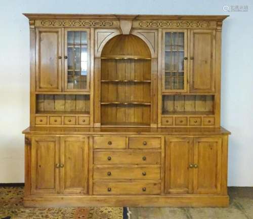 A large 20thC dresser with a moulded cornice above a blind f...