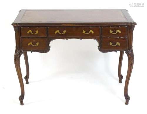 A late 19thC / early 20thC French style mahogany desk by  Ed...