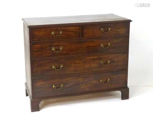 A mid 18thC mahogany chest of drawers with a moulded top abo...