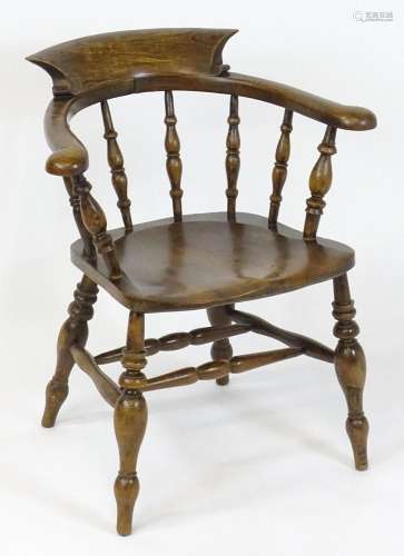 A late 19thC / early 20thC elm smokers bow Windsor chair, ha...