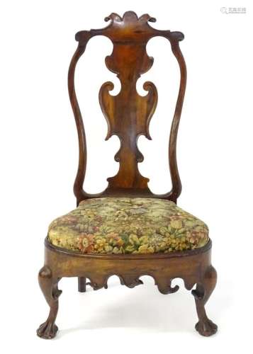 An early 18thC Anglo-Portuguese chair with carved top rail a...