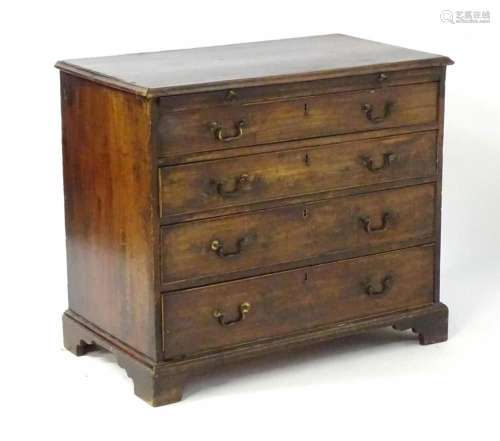 A mid / late 18thC chest of drawers with a moulded top above...