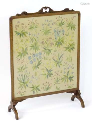 A late 19thC / early 20thC mahogany fire screen with a carve...