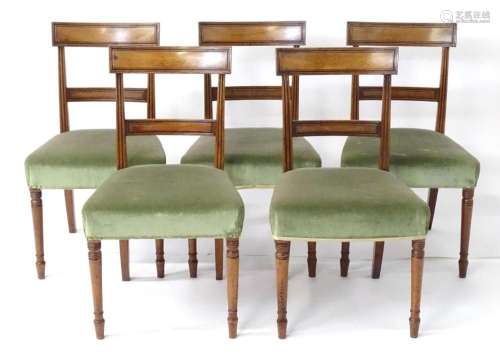 A set of five Regency period mahogany dining tables with ree...