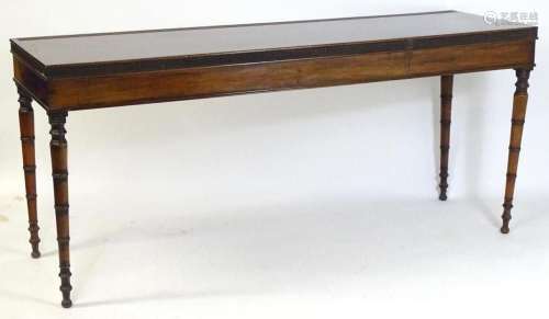A Regency period mahogany serving table with a crossbanded t...