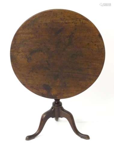 A mid 18thC mahogany tripod tilt top table, having a circula...