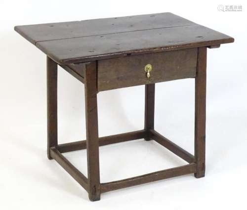 A 17thC and later oak side table with an overhanging top abo...