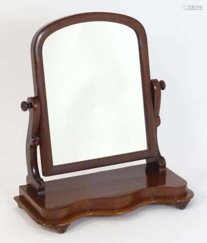A late 19thC mahogany toilet mirror, having an arched surrou...