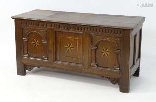 A 17thC coffer with a moulded lid above a nulled frieze and ...