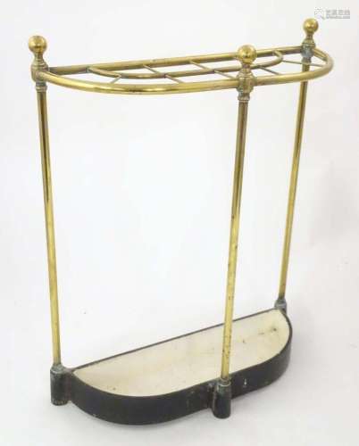 A Victorian brass and cast iron stick stand, of demi lune fo...