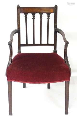 A late 18thC mahogany Adam designed open armchair with flute...