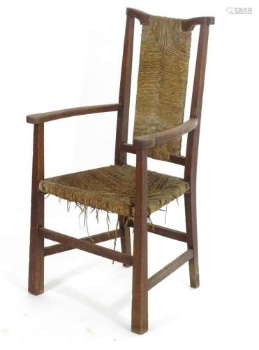 A late 19thC oak Arts & Crafts open armchair attributed ...
