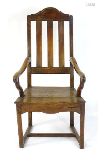 An early 18thC Scottish fruitwood and elm open armchair with...