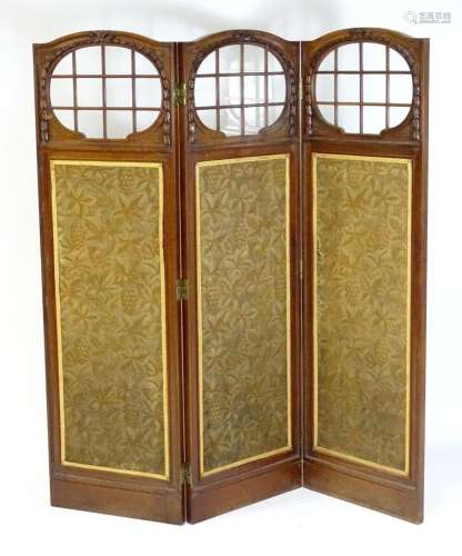 A late 19thC / early 20thC walnut three fold screen with car...