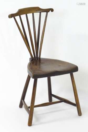 An early 20thC Windsor turners chair, having a spindle back ...