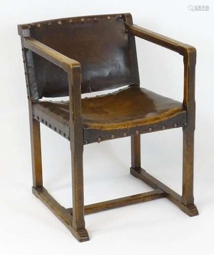 An early 20thC open armchair / elbow chair with a chamfered ...