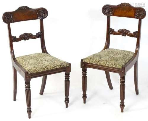 A pair of mid 19thC mahogany dining chairs with a shaped top...