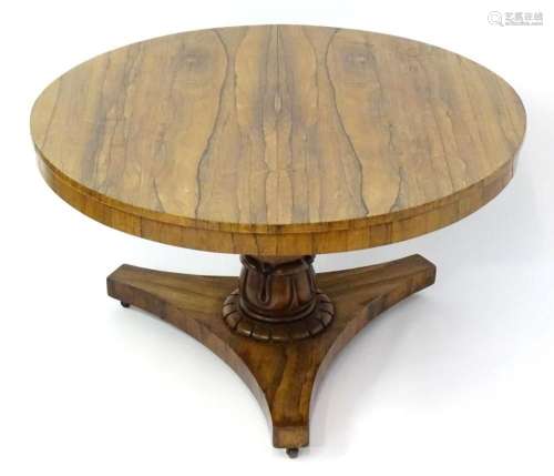 A mid 19thC rosewood centre / breakfast table, having a figu...