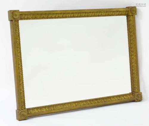 A late 18th / early 19thC mirror with a giltwood and gesso f...