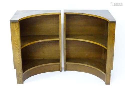 A pair of mid 20thC Art Deco oak corner bookcases with conca...