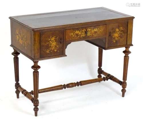 A late 19thC rosewood writing desk with a rectangular moulde...