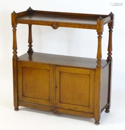 A late 19thC buffet / whatnot with a shaped upstand above tw...