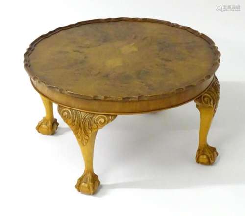 A mid / late 20thC walnut coffee table with a burr walnut ve...